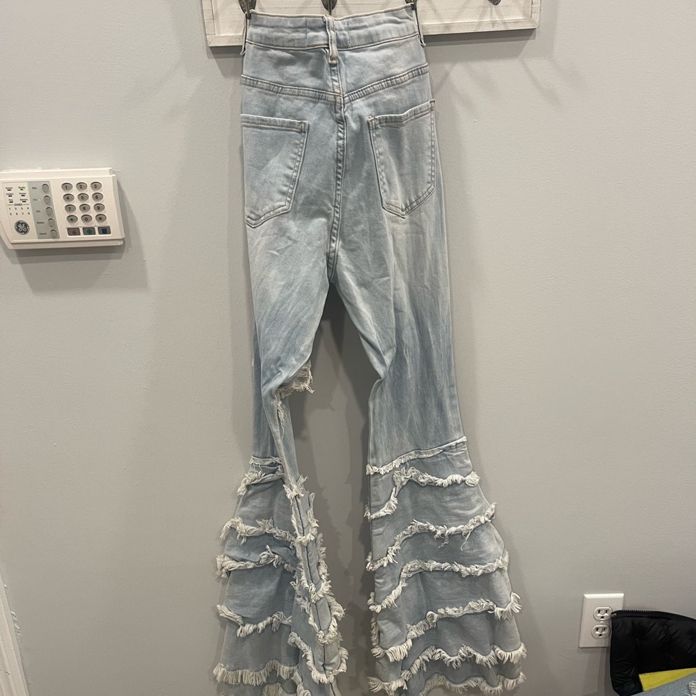 Stylish jeans ruffles at bottom